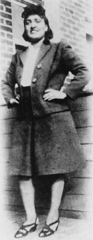 Image shows Henrietta Lacks standing against a wall