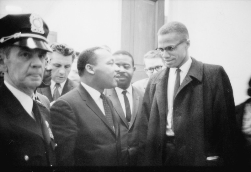 Image shows a photo of Dr. Martin Luther King Jr. and Malcolm X  at the U.S. Capitol