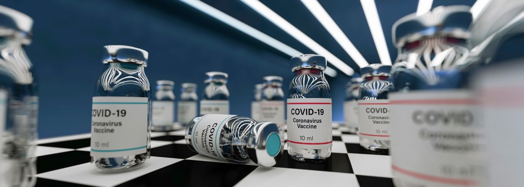 A photograph of vials containing the COVID-19 vaccine