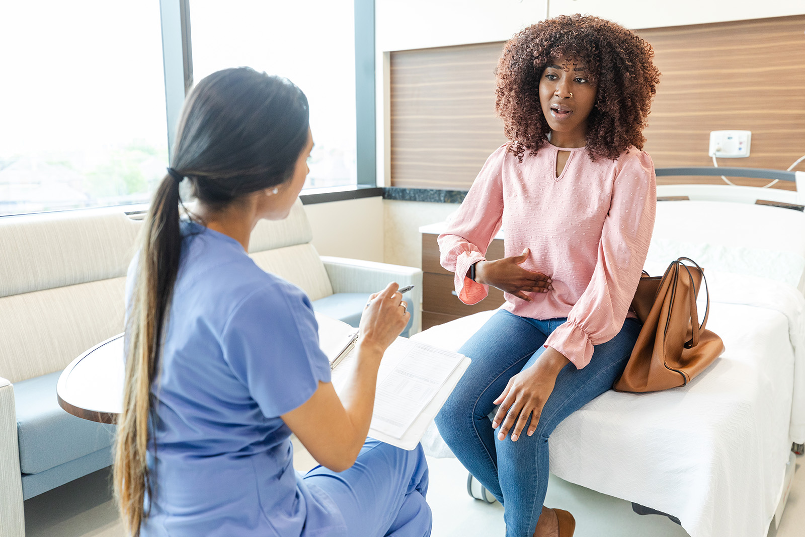 Woman speaking with a doctor