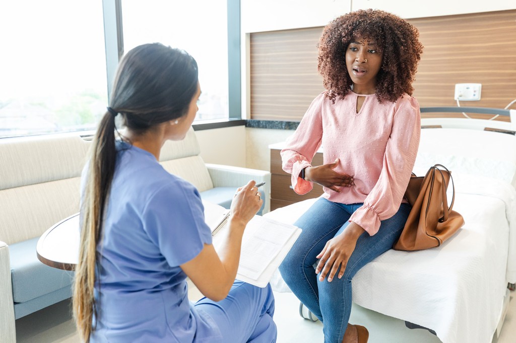 Woman speaking with a doctor